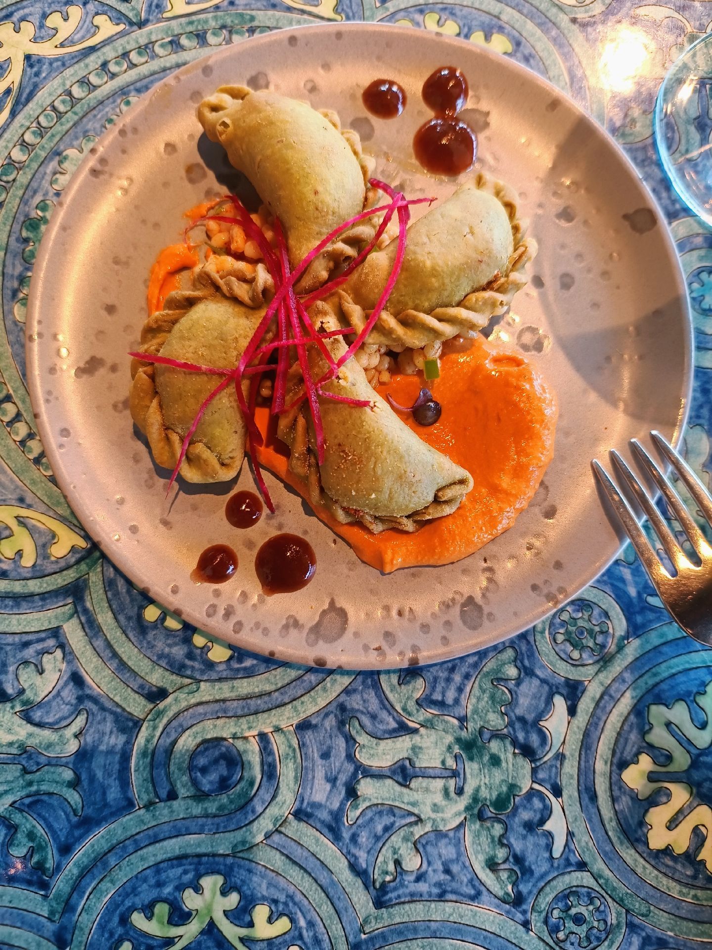 Modern Indian appetisers plated with sauces and pickled garnish at Indya by Vineet, Dubai