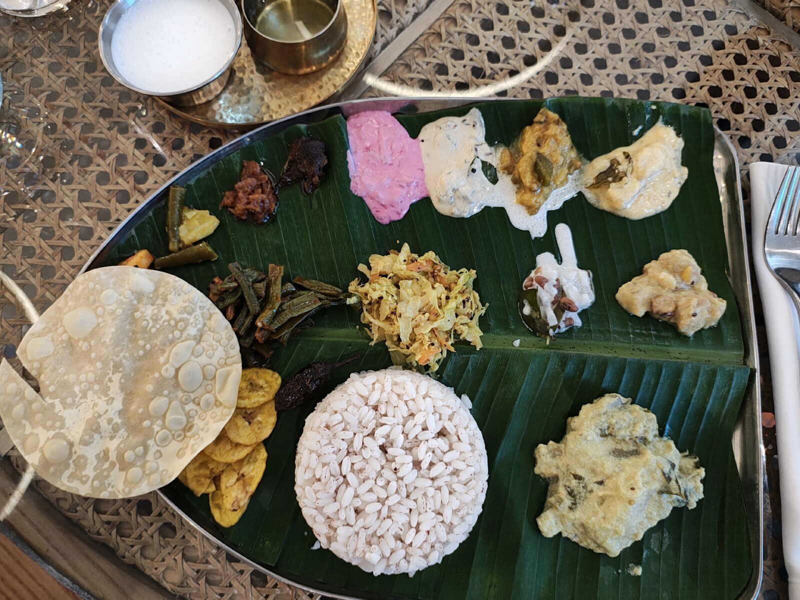 Onam sadhya plated on banana leaf at The Crossing, Dubai